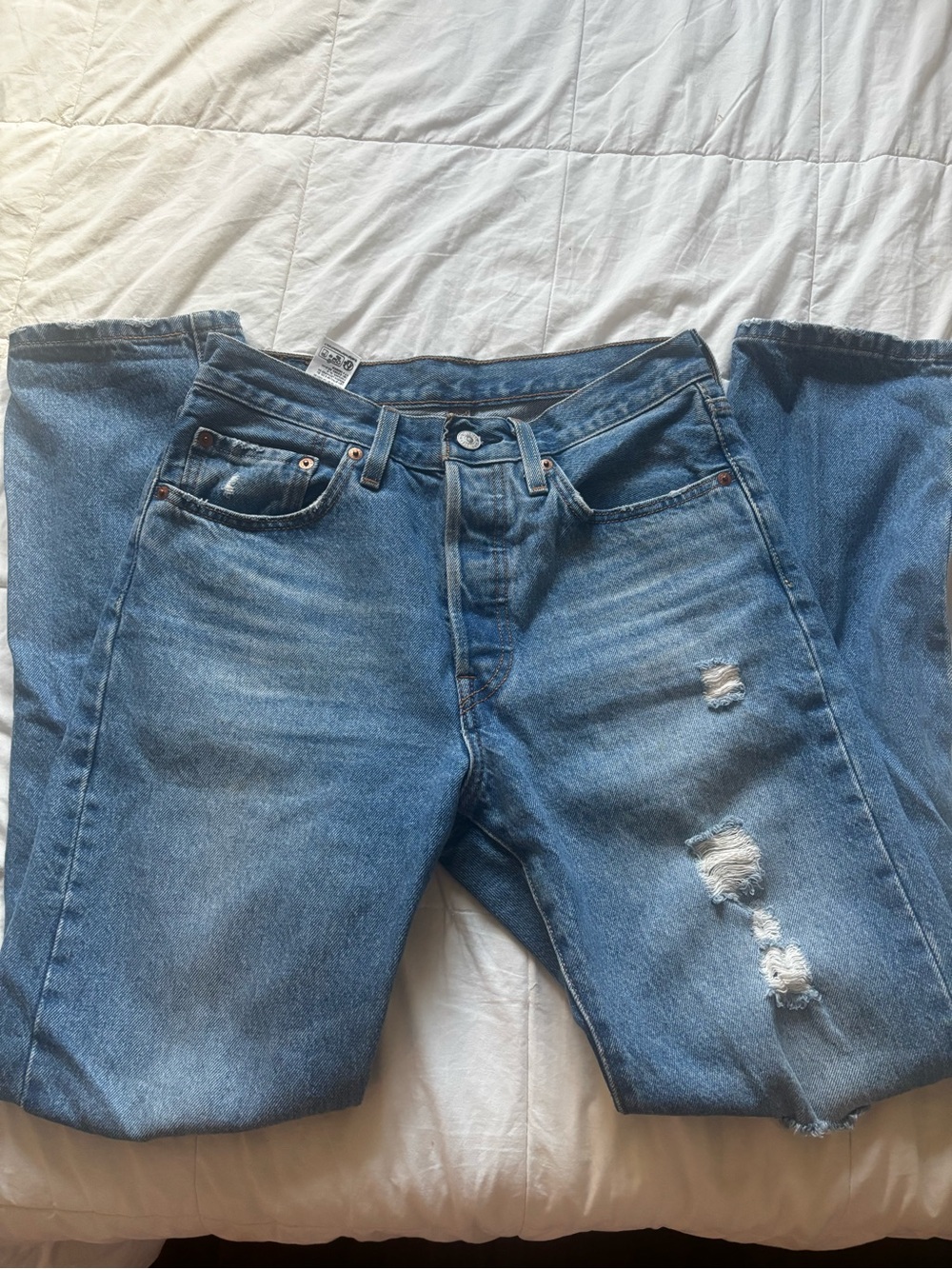 Levi’s 501 ripped jeans